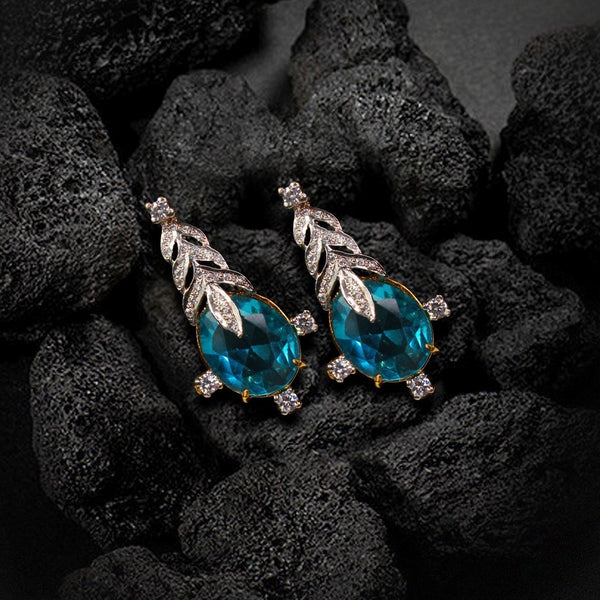 Tops in Blue Zircons and Cubic Zircons